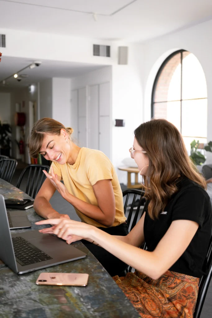 Two girls talking with each other on How to find Accountant in London