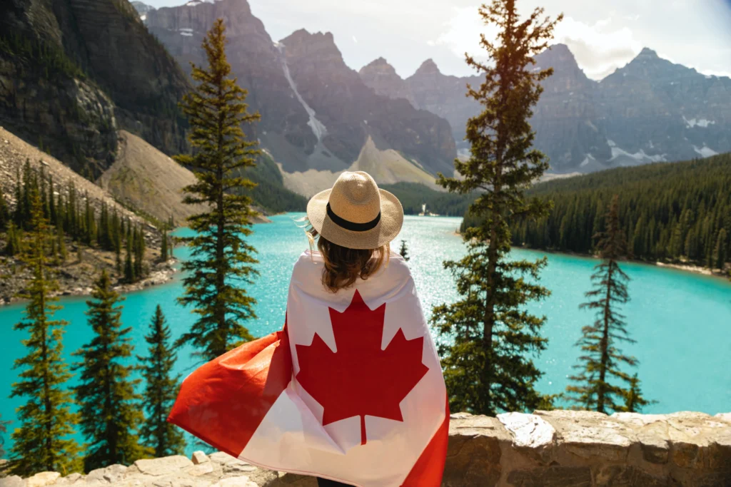 A woman covered in Canadian flag